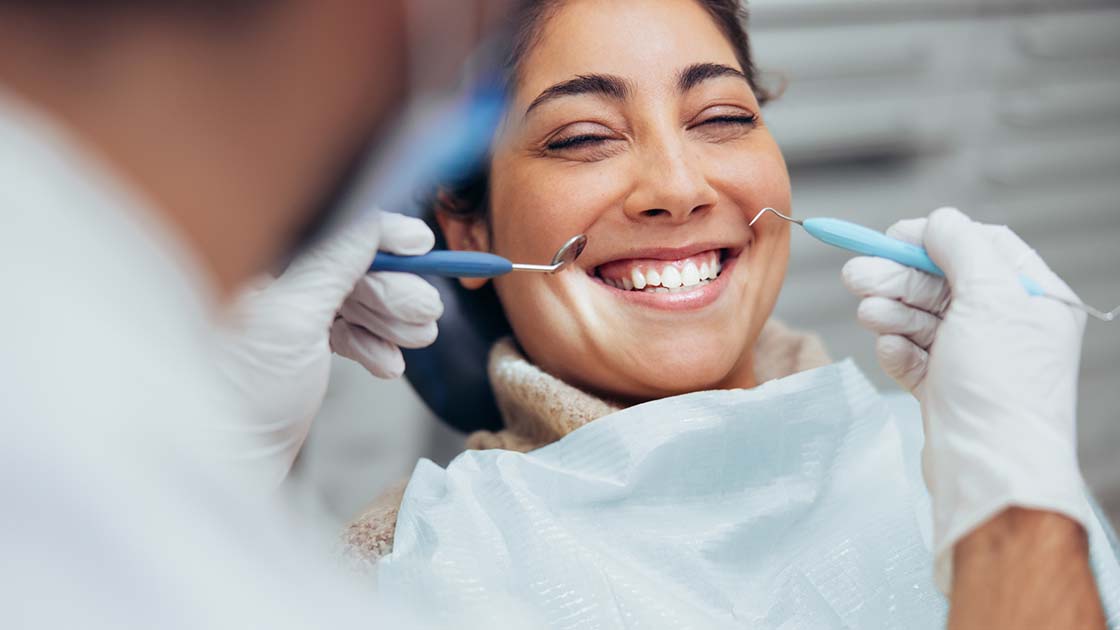 happy-woman-at-dental-exam